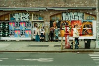 a group of people standing in front of a building