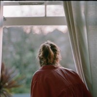 a woman looking out a window